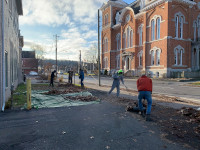 ATI  Working on Court Street raking leaves in preparation for the lights on the river event. 